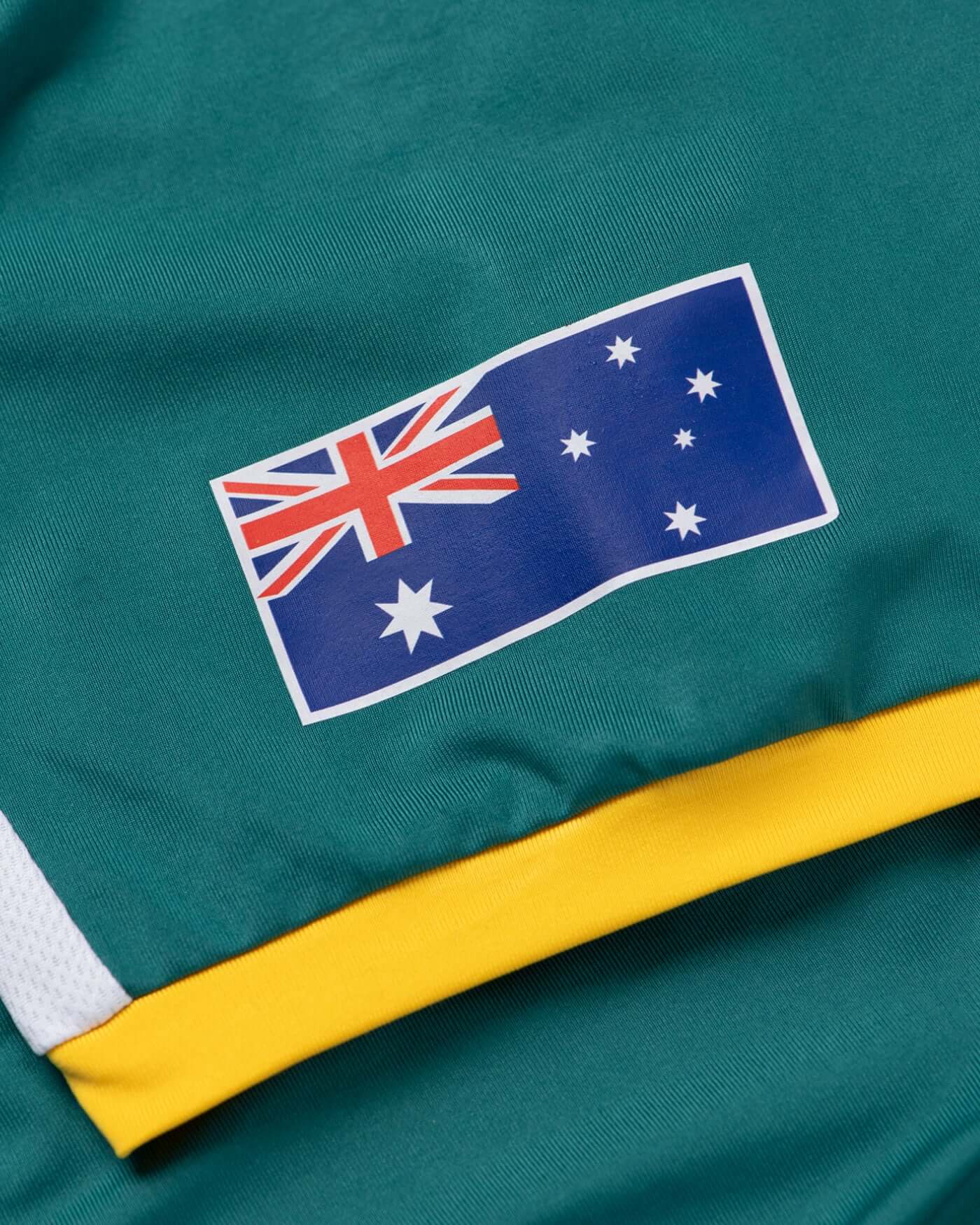 Home Race '26 Jersey featuring Australian flag design with vibrant Aussie green and gold colors.