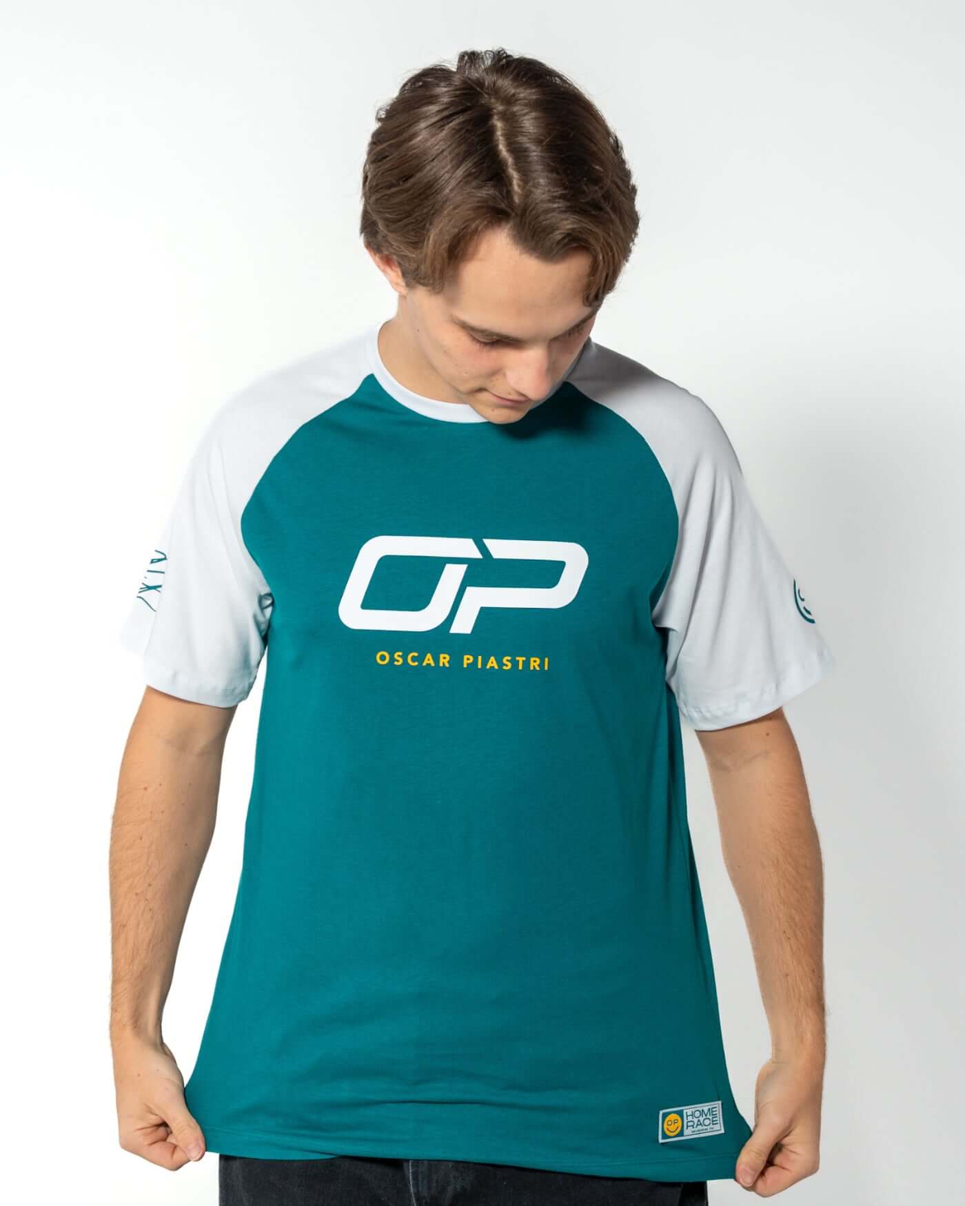 Home Race '26 T-Shirt - Green worn by Oscar, featuring Oscar Piastri's OP logo and a modern design.