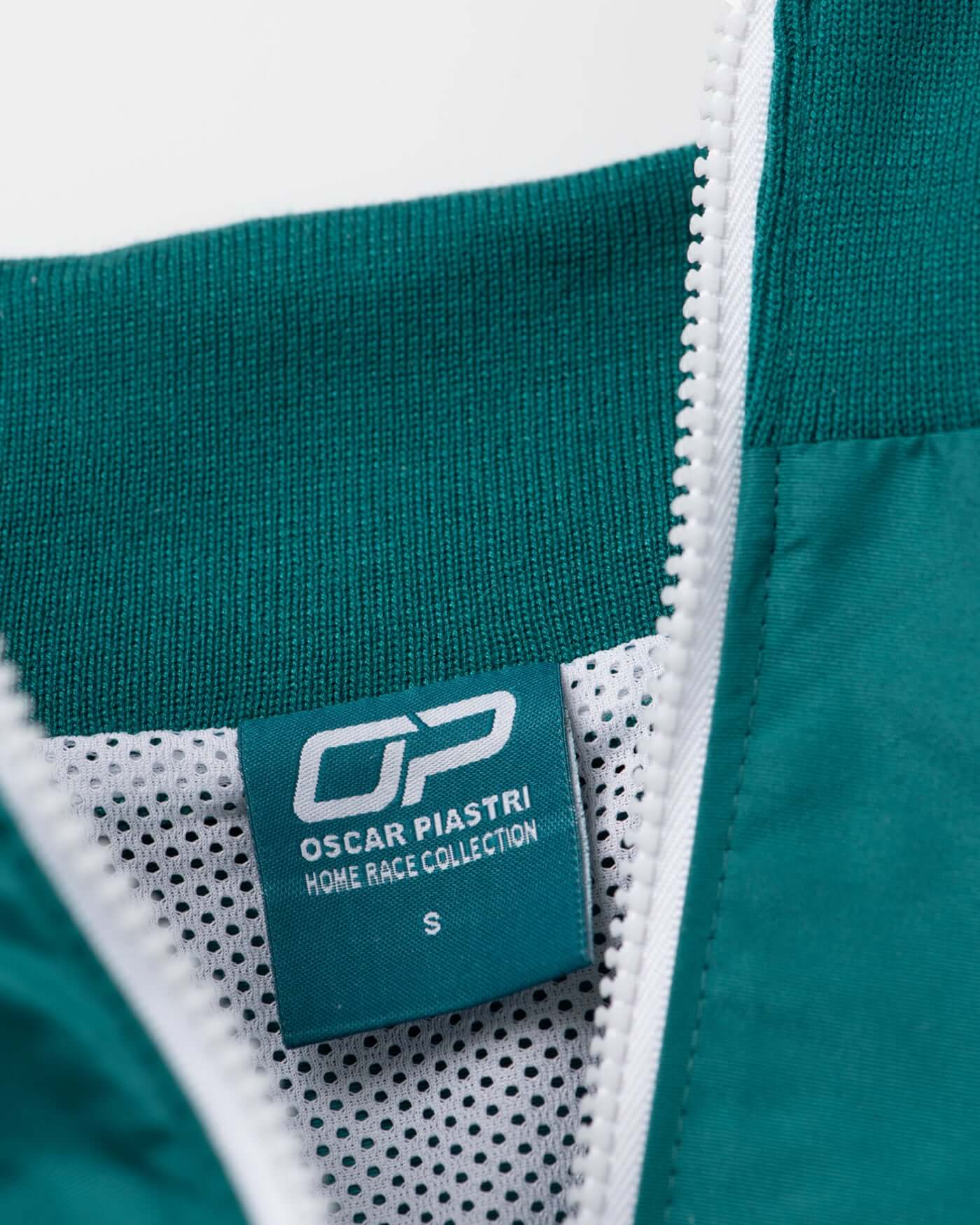 Home Race '26 Race Jacket label showcasing Oscar Piastri's design, perfect for motorsport fans.