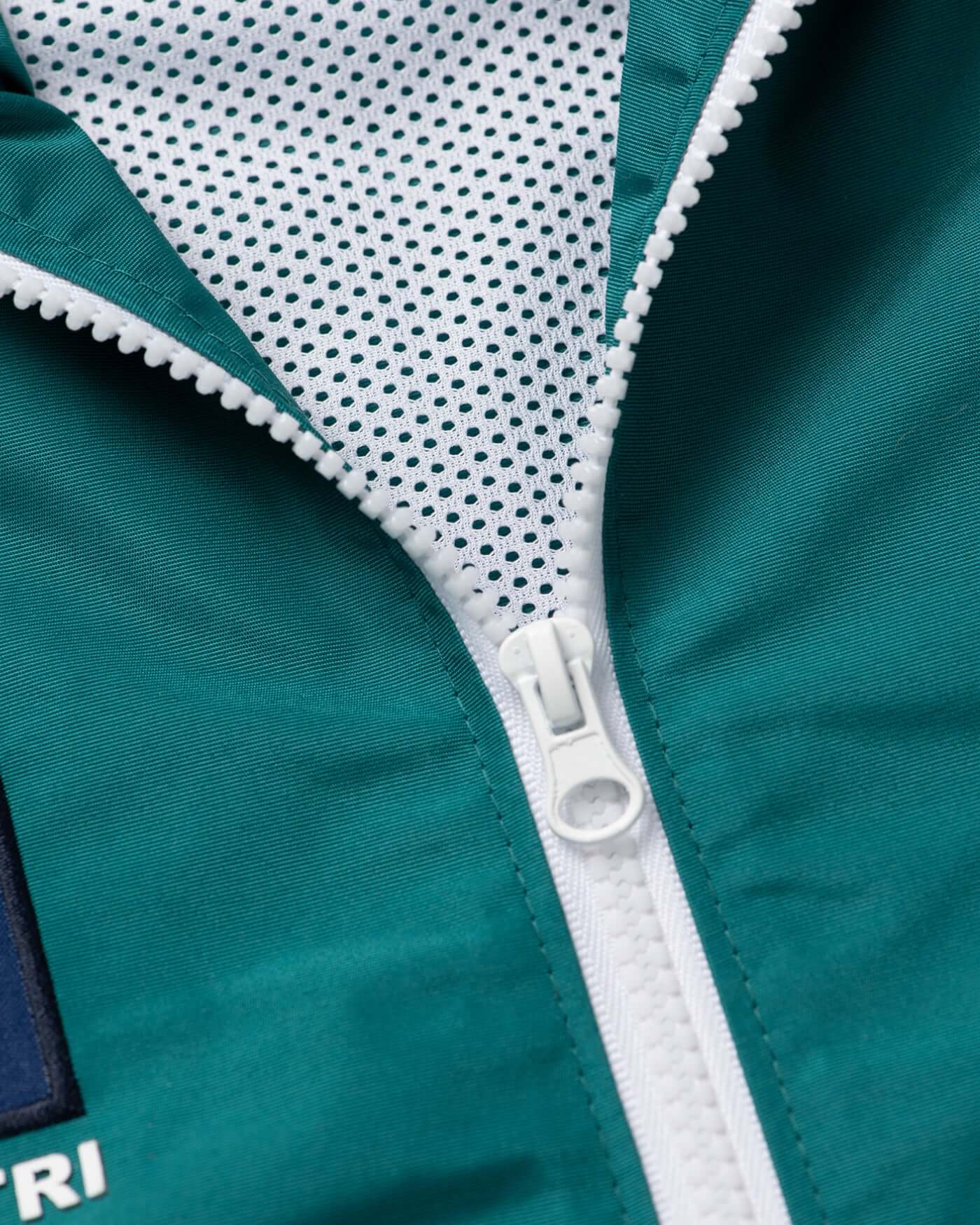 Close-up of the zipper detail on the Home Race '26 Race Jacket showcasing its quality and design.