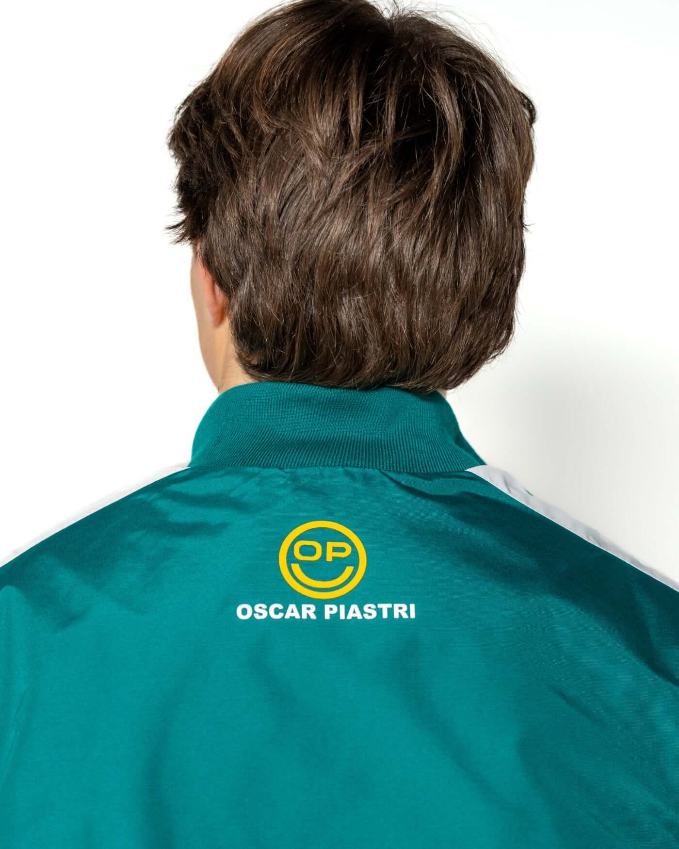 Home Race '26 Race Jacket featuring OP smiley accents and Oscar Piastri branding on the back.