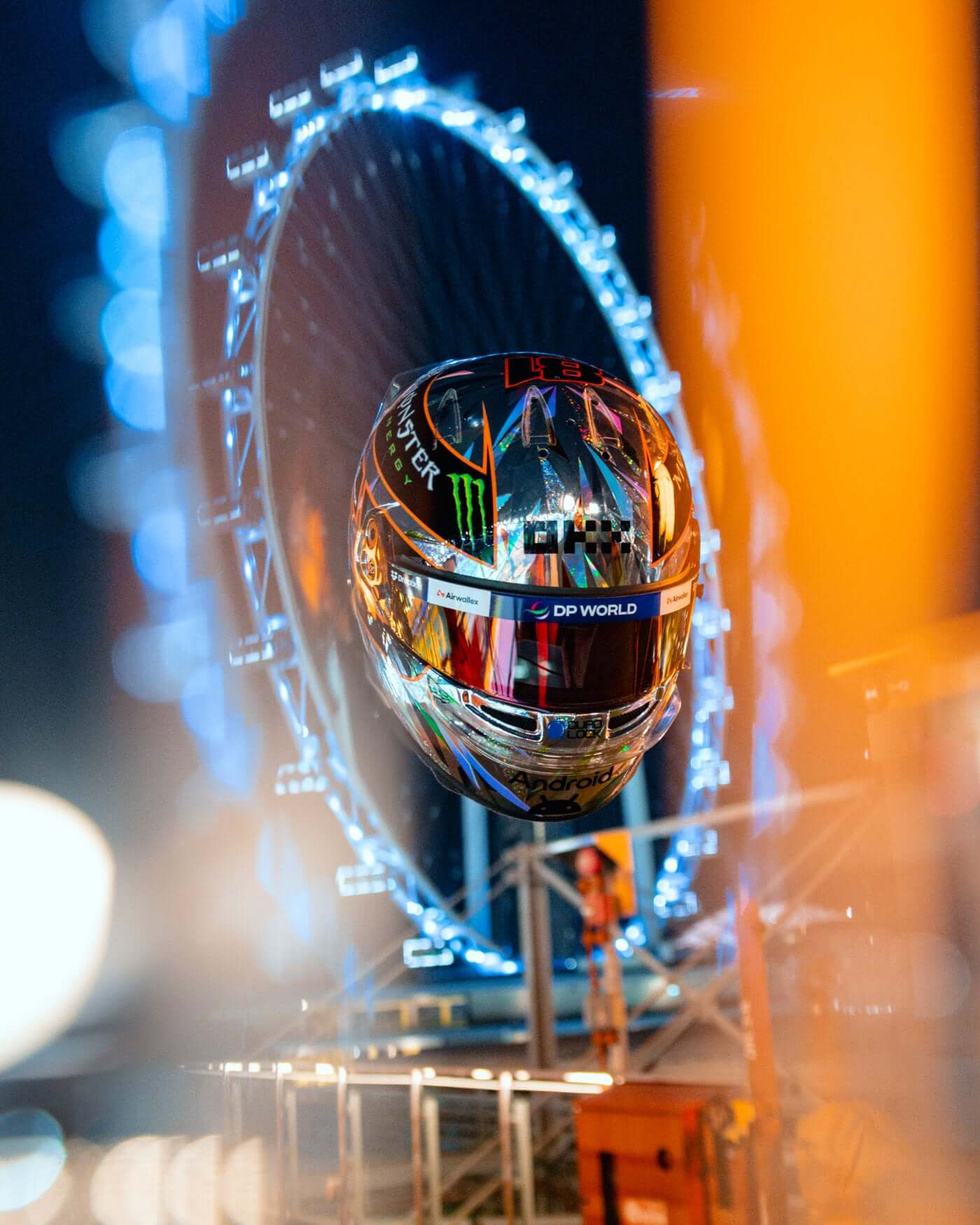 1:2 scale 2024 Singapore Helmet - Oscar Piastri with illuminated background displaying intricate details and vibrant design.