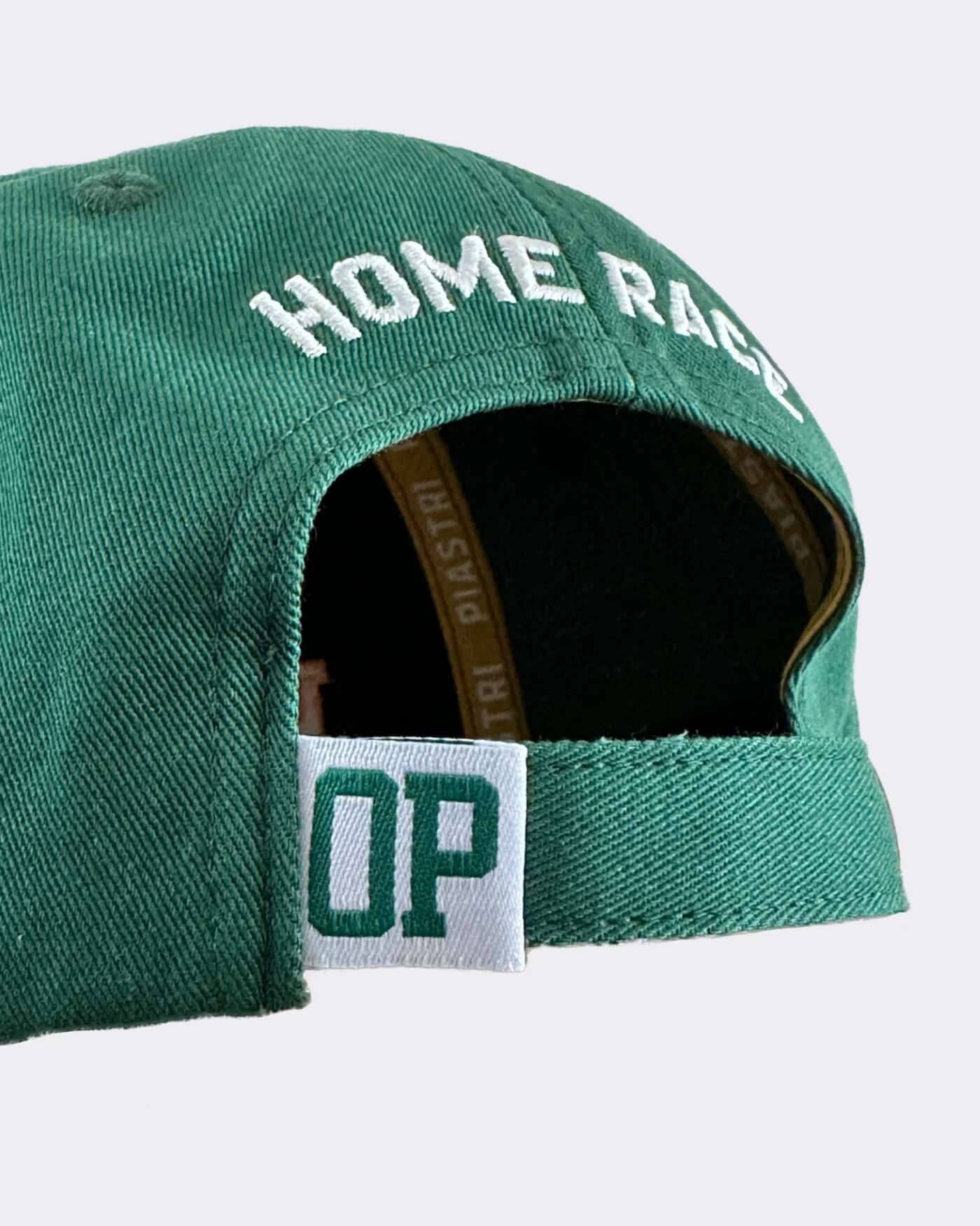 Green cap showcasing "HOME RACE" embroidery, part of the exclusive Victory Bundle for champions.