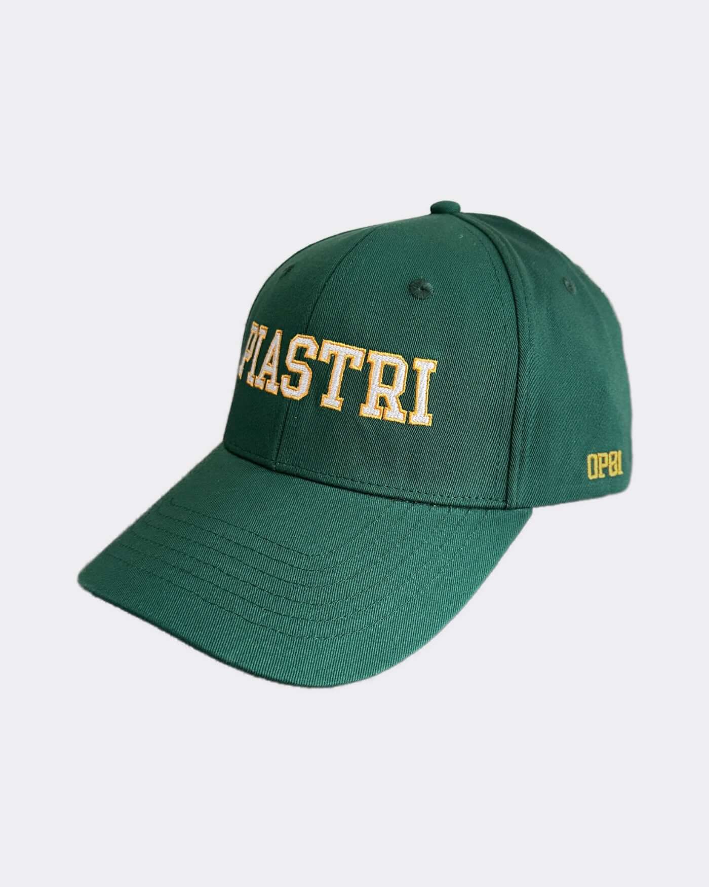 Green cap with yellow 'PIASTRI' lettering, part of the exclusive Victory Bundle, perfect for celebrating championship victories.
