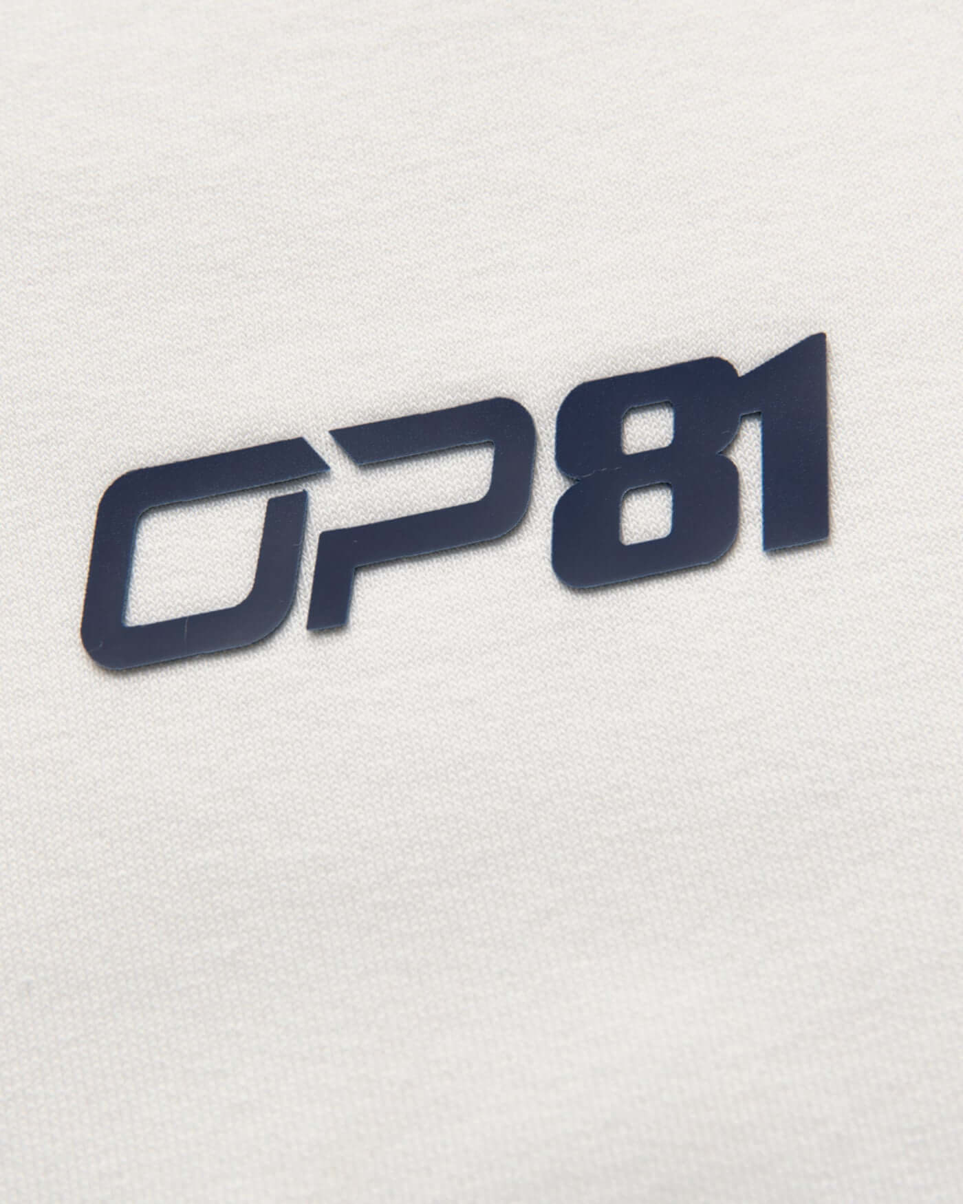 OP81 logo detail on the Signature Oversized Hoodie - Off White fabric.