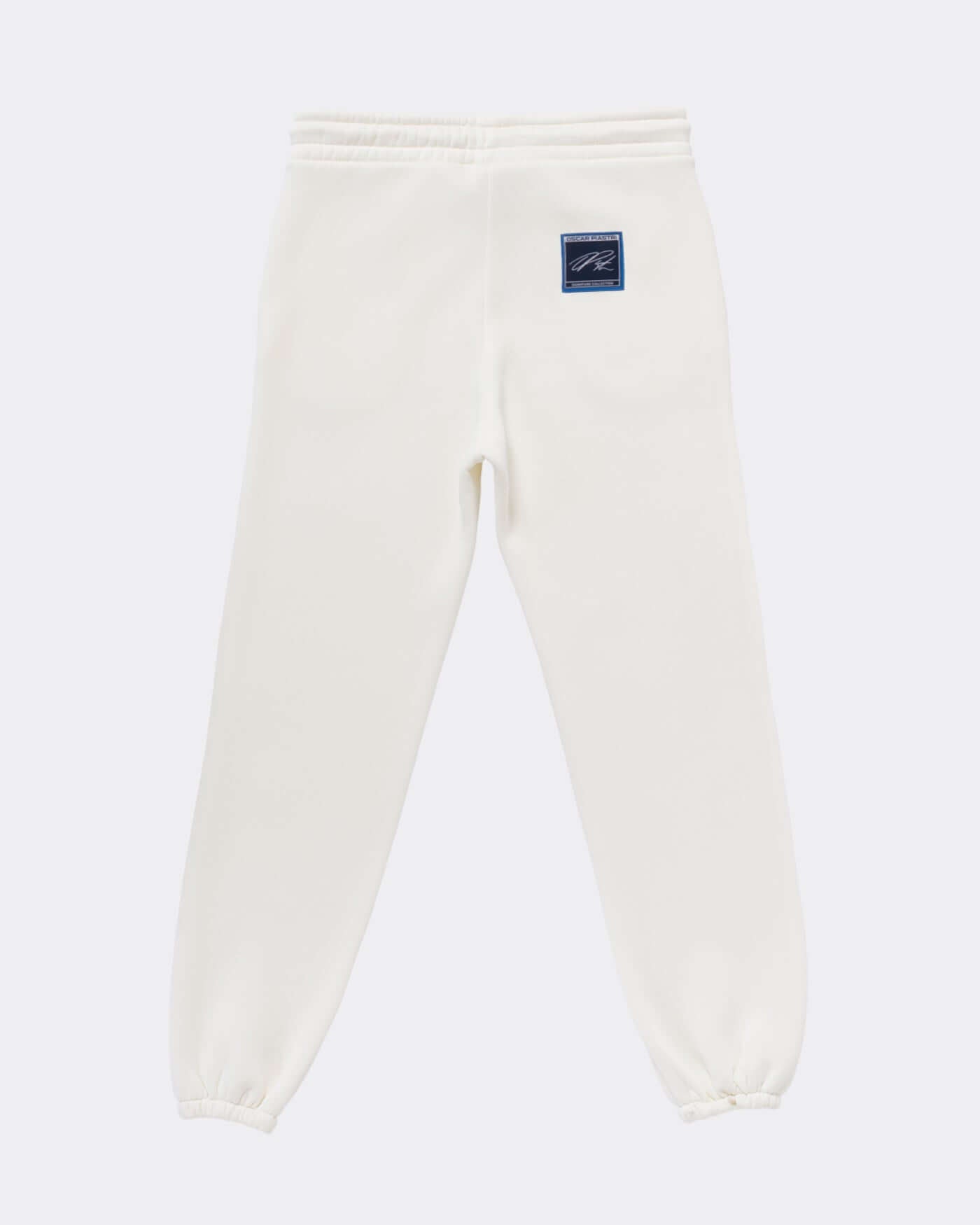 Signature Joggers - Off White showcasing the back view with rubber logo patch detail.