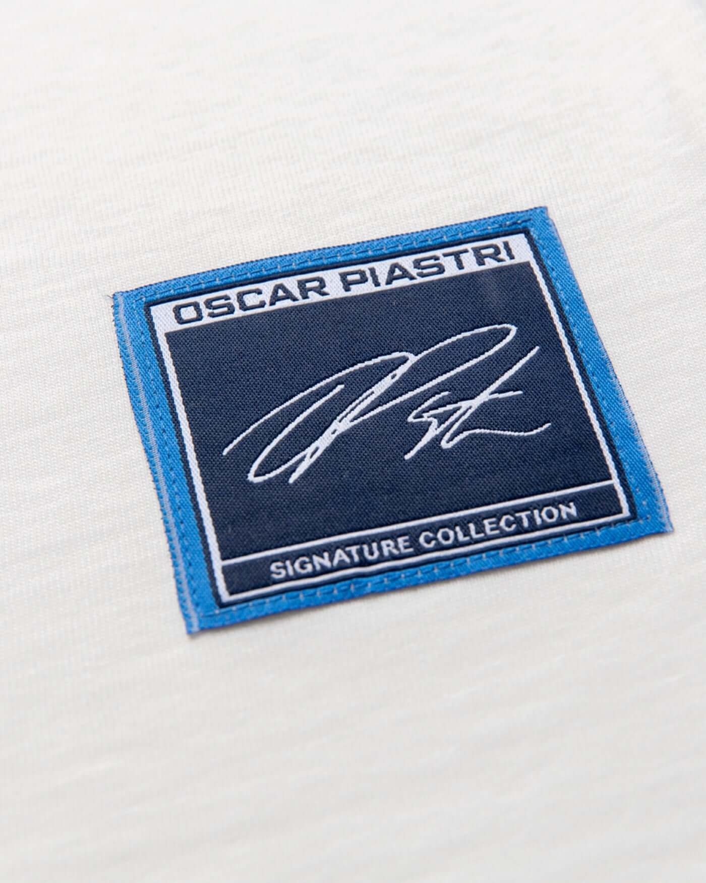 Close-up of the Oscar Piastri signature patch from the Signature Joggers - Off White collection.