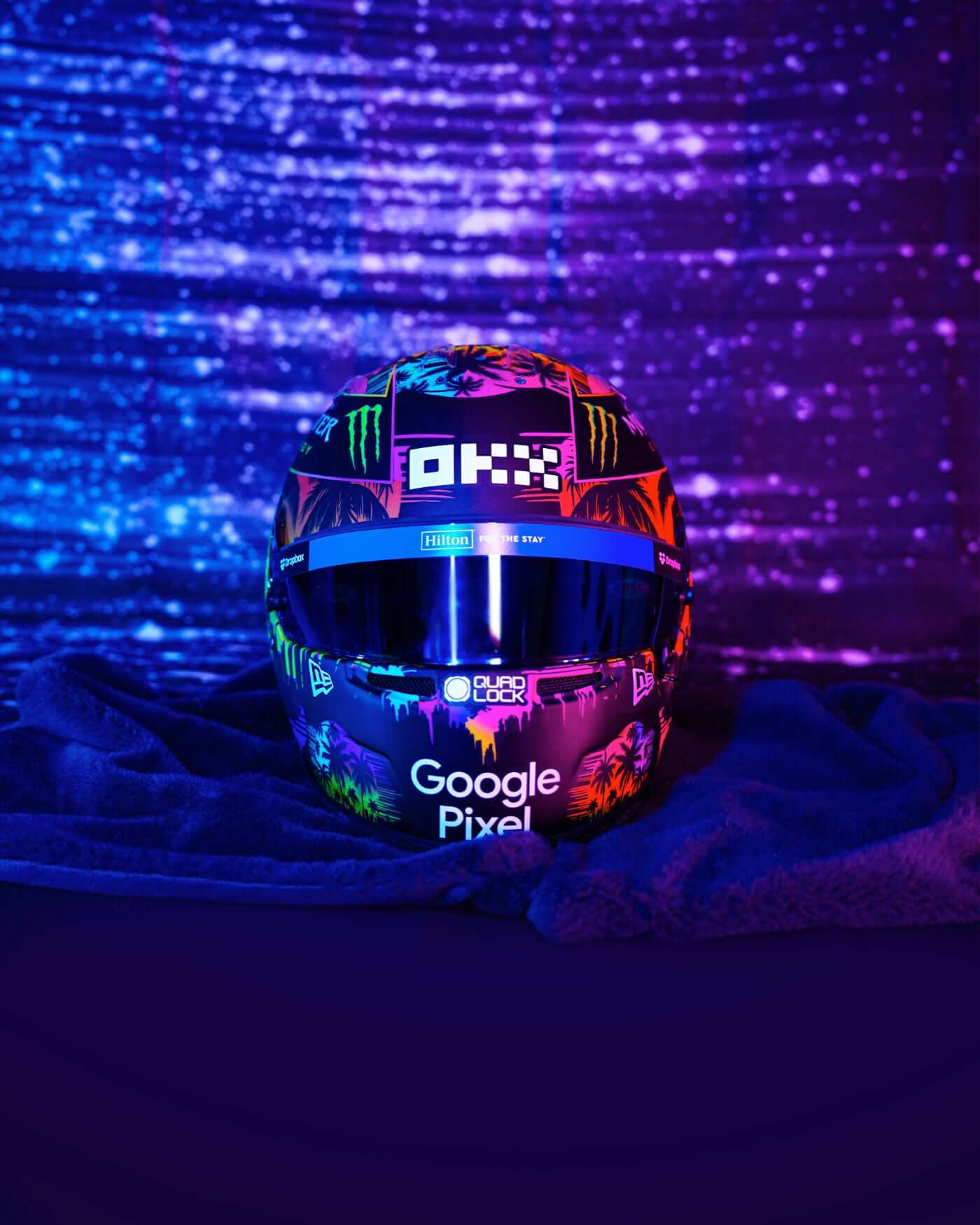 1:2 scale 2024 Miami Helmet - Oscar Piastri replica by Bell, showcasing vibrant Miami design and #OP81 logo under neon lights