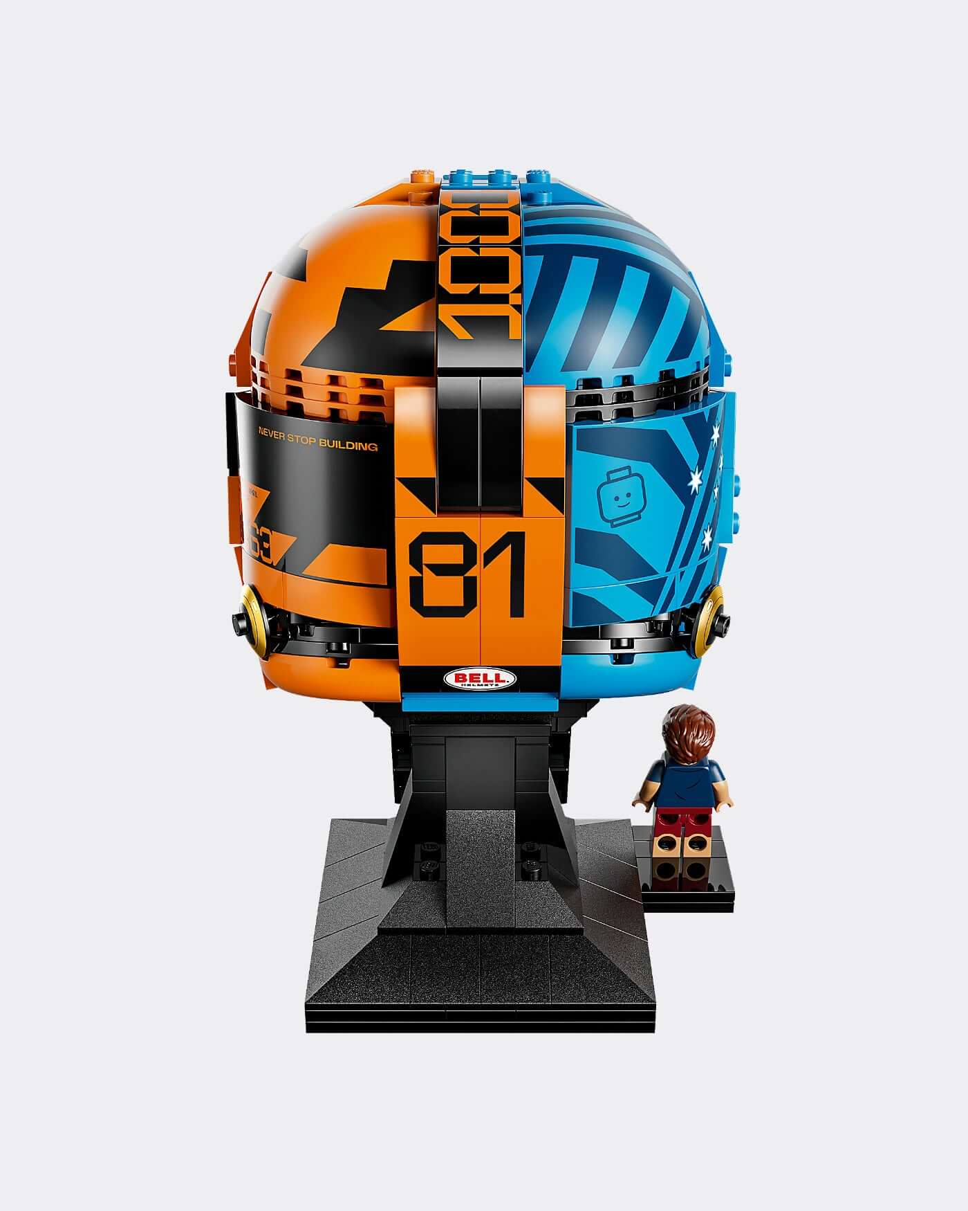 LEGO® Editions McLaren Mastercard F1® Team Oscar Piastri Helmet displayed with a LEGO figure on a stand.