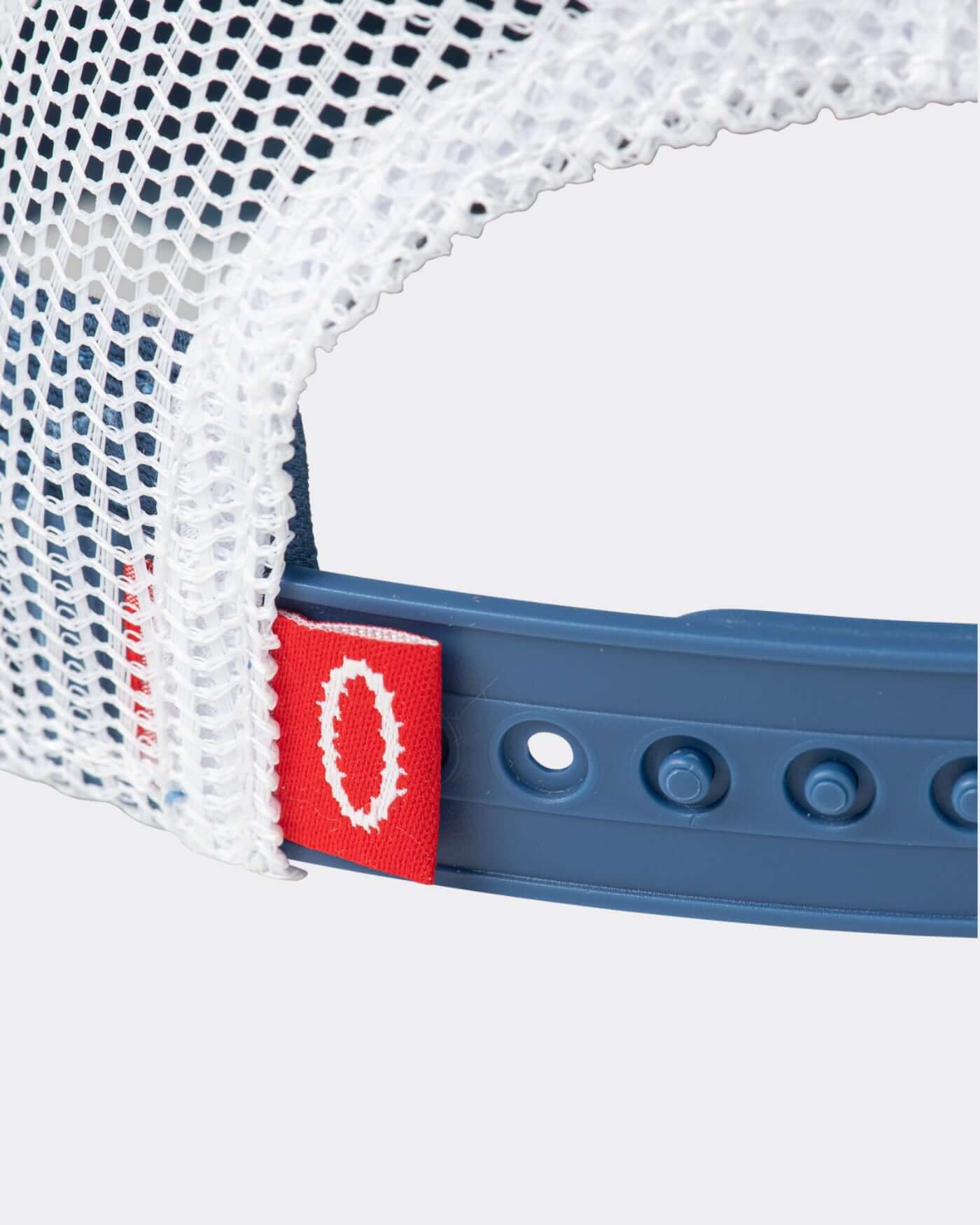 Origins Cap adjustable snapstrap detail on classic 00s trucker cap with breathable mesh.