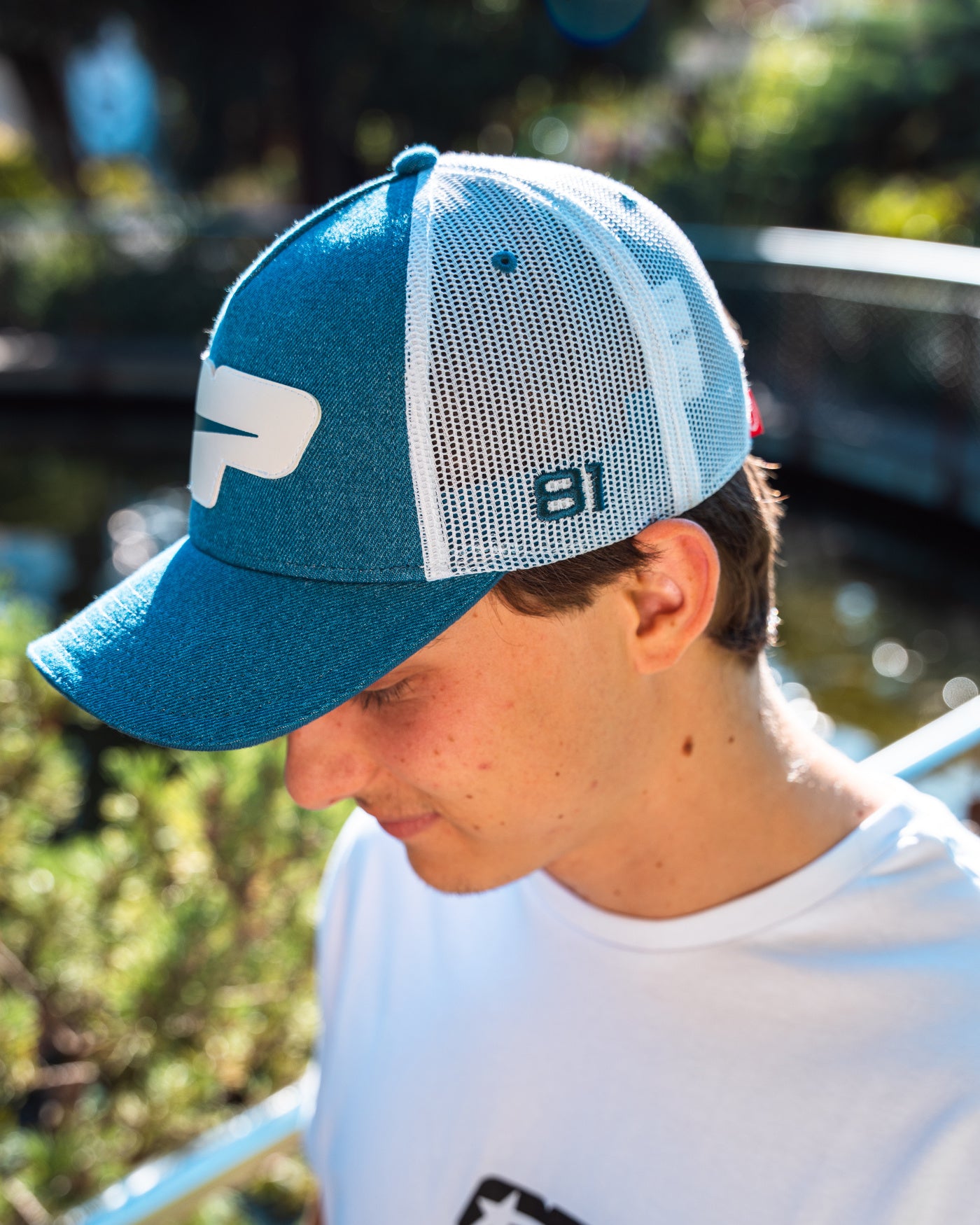 Origins Cap worn by Oscar outdoors, showcasing its retro design and breathable mesh panels.