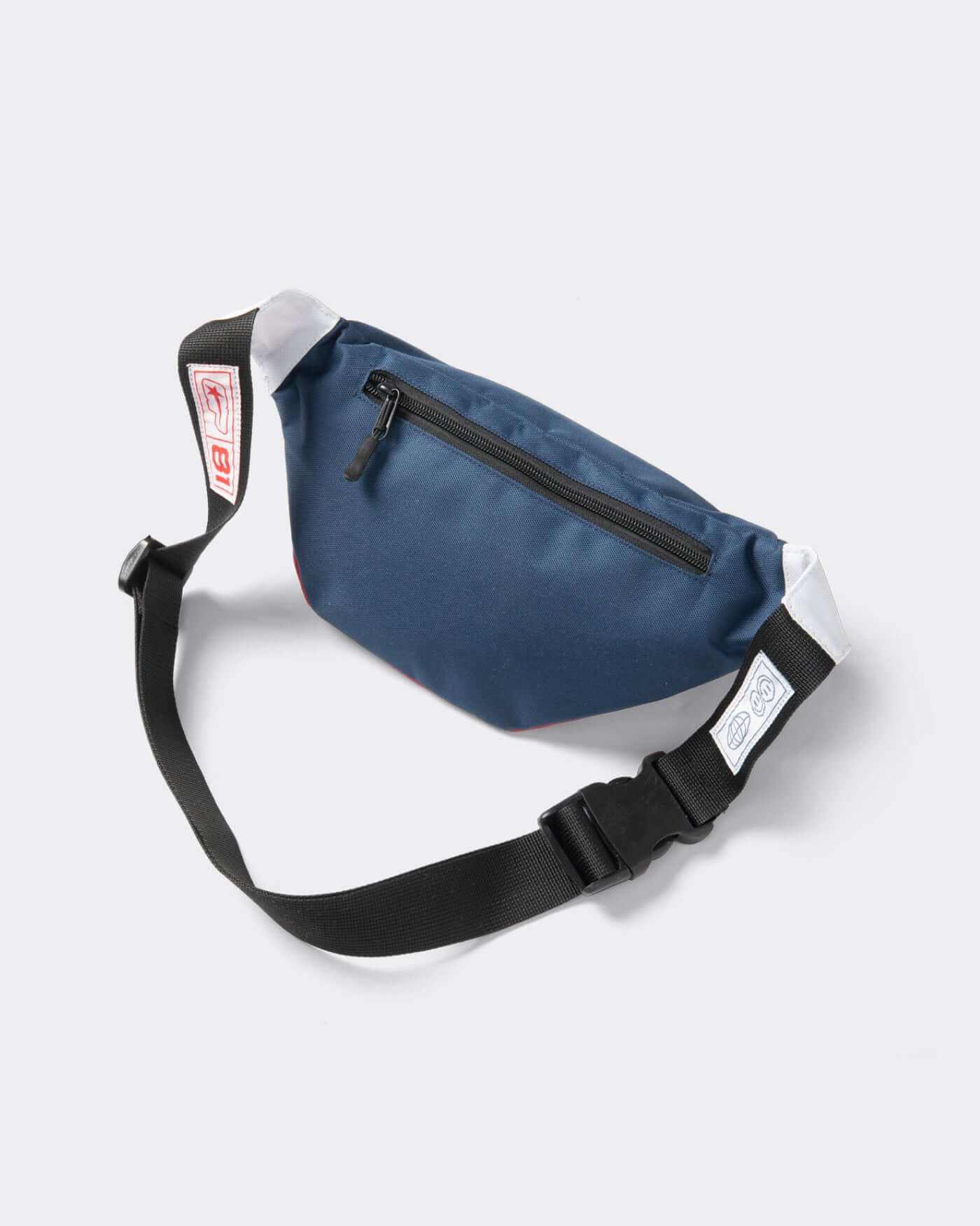 Origins Crossbody Bag in navy blue with adjustable strap and zippered pocket, perfect for hands-free style.