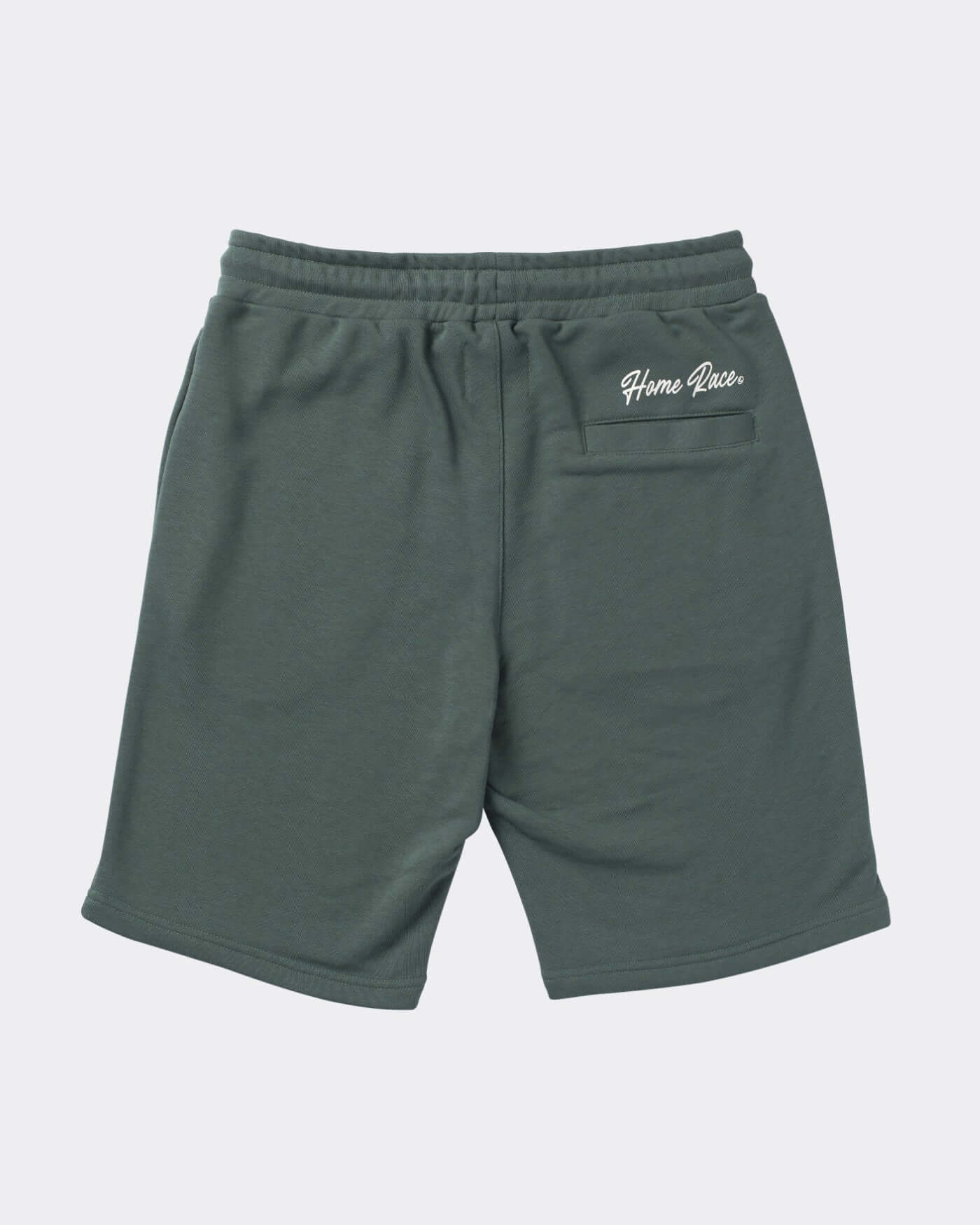 Back view of Home Race Shorts in green fabric, featuring adjustable waistband and sleek design for active wear.