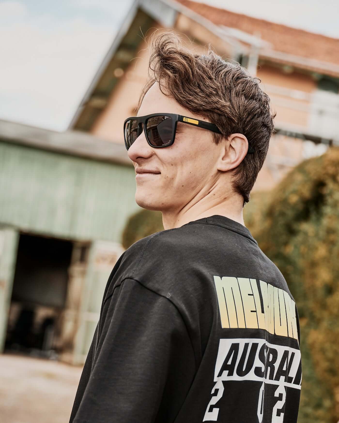 McLaren F1 Team Oscar Piastri wearing SunGod sunglasses, showcasing style and performance.