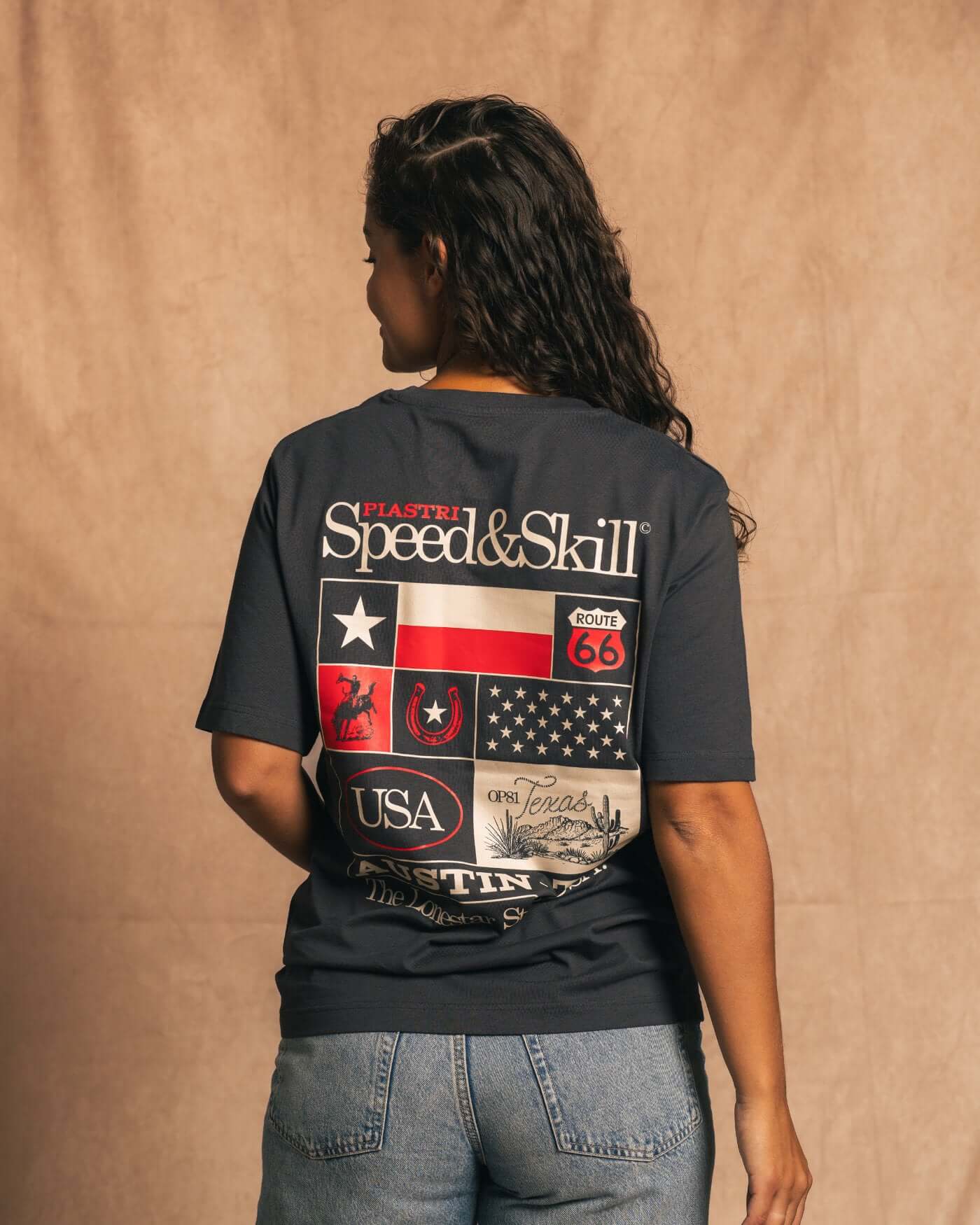 Woman wearing Texas 2024 T-Shirt featuring COTA-inspired design and Western graphics, celebrating speed and skill.