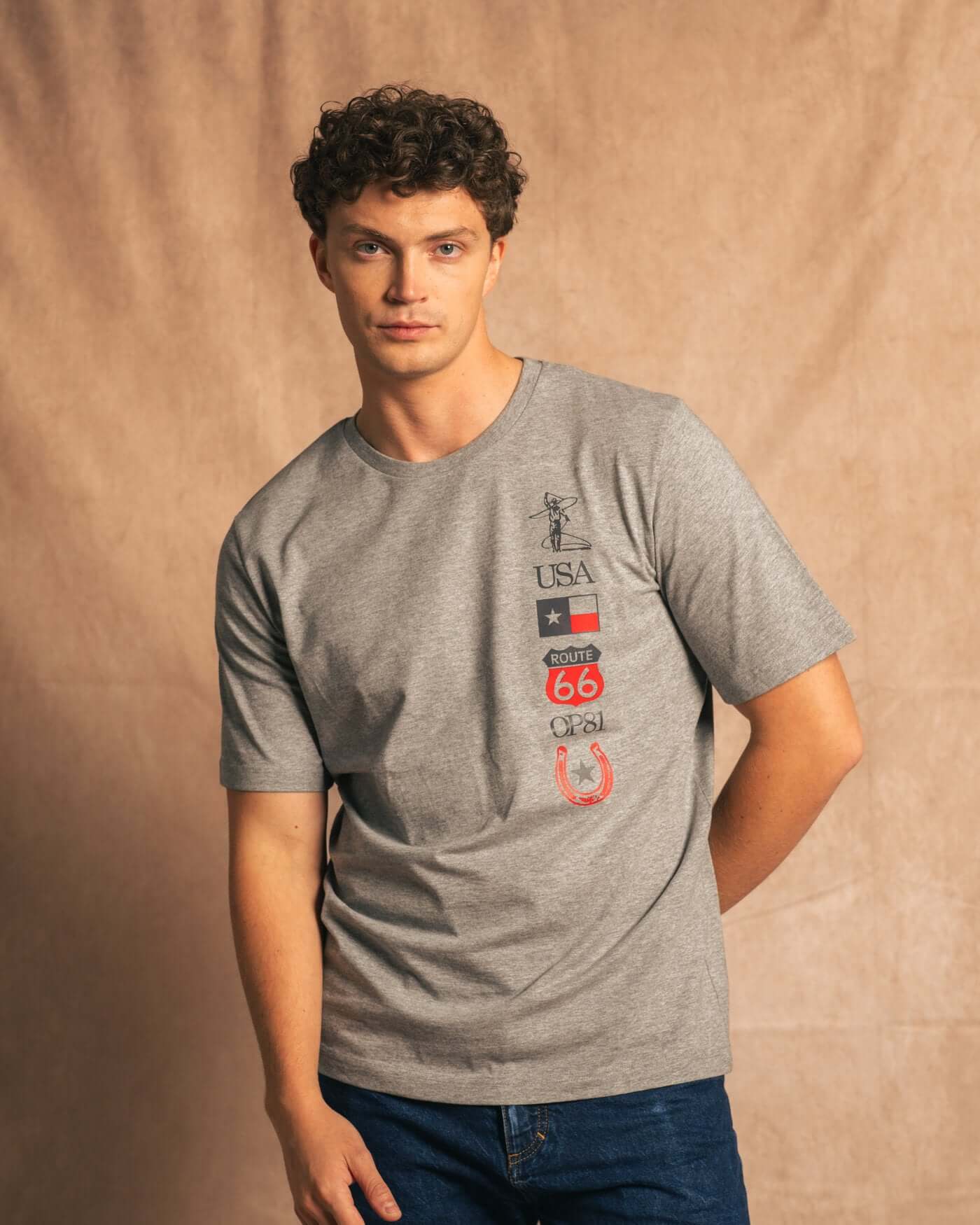 Man wearing Texas 2024 T-Shirt in light grey with Texas and Formula 1 inspired graphics.