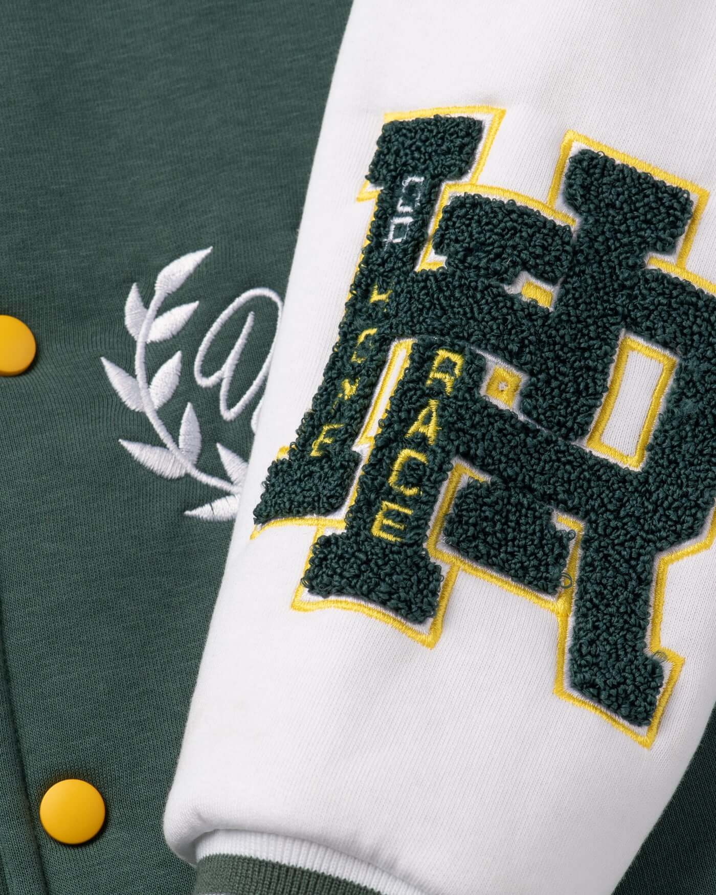 Close-up of Home Race Varsity Jacket showcasing chenille embroidery patches and stylish details.
