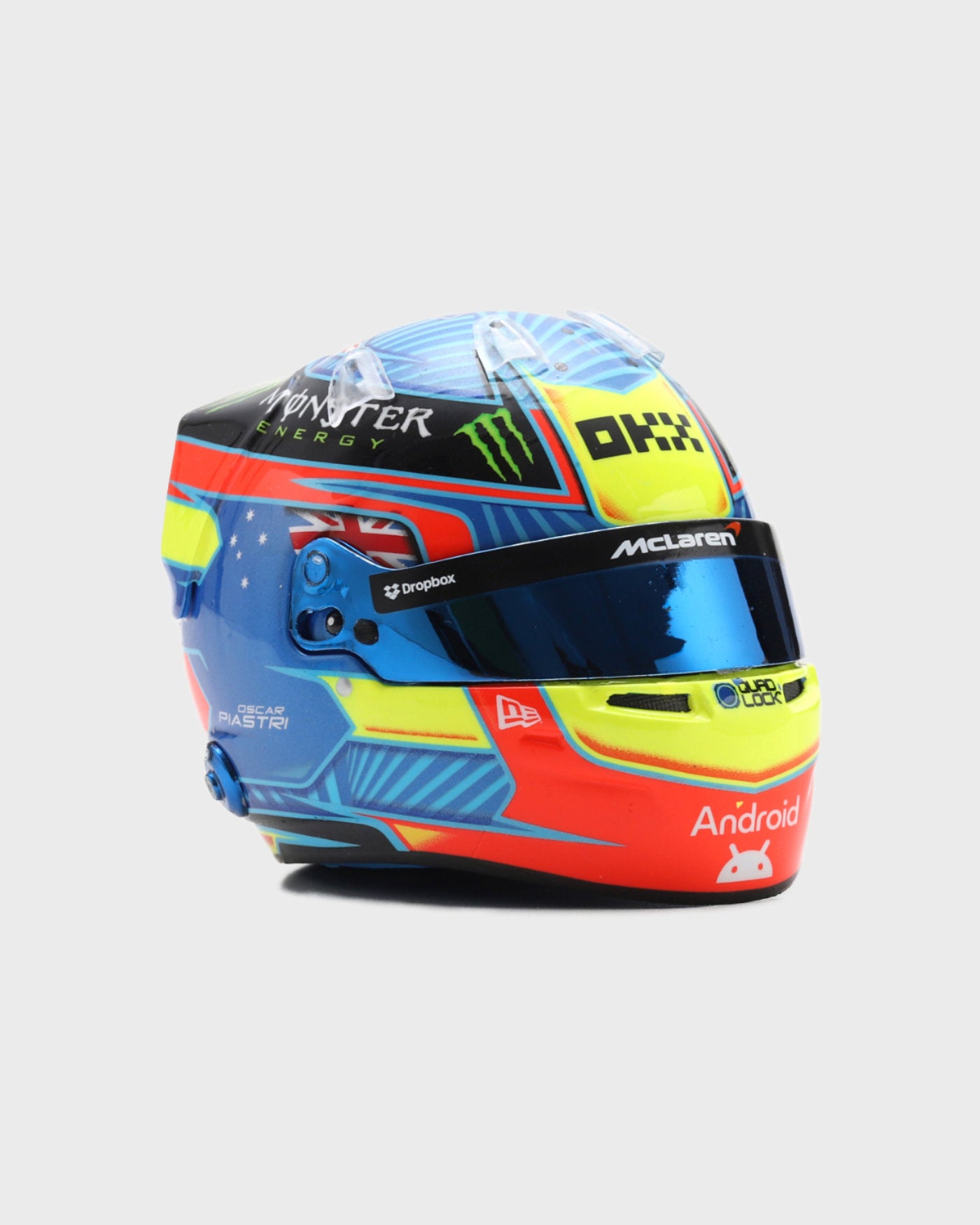 1:5 scale 2024 Oscar Piastri F1 helmet replica featuring red, blue, yellow design with racing number and logos by Spark.