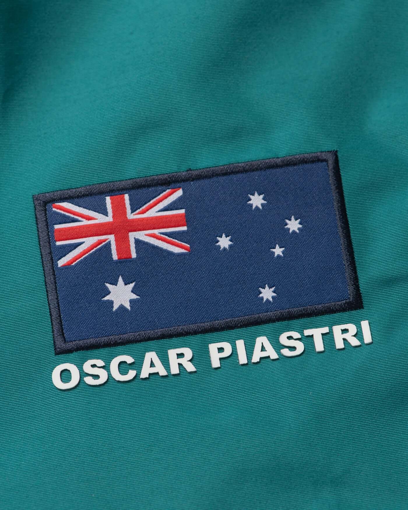 Close-up of the Australian flag and 'Oscar Piastri' on the Home Race '26 Race Jacket.