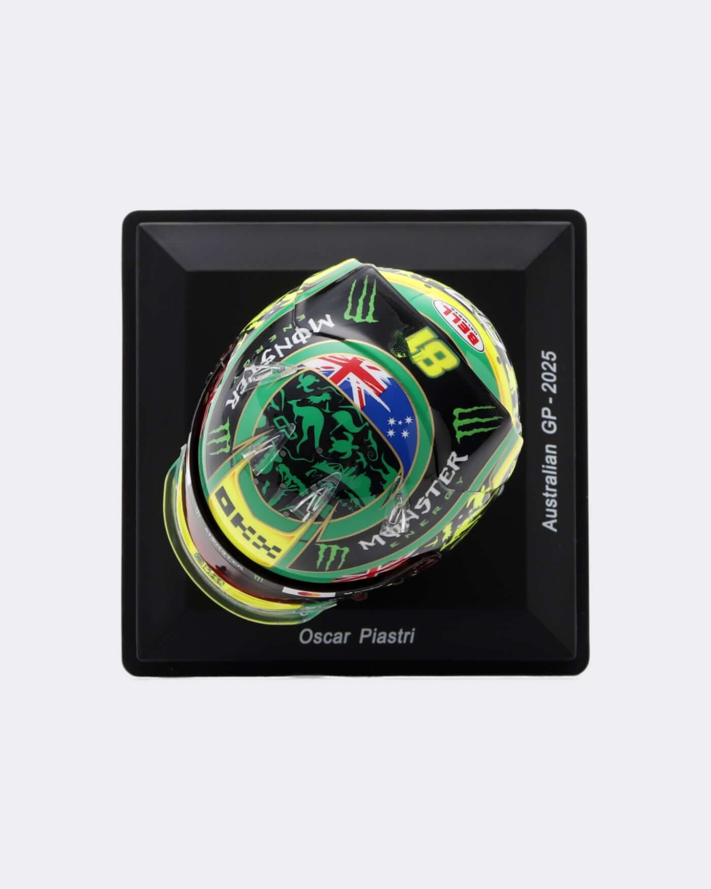 1:5 scale 2025 Australia Helmet - Oscar Piastri displayed in a showcase featuring vibrant design and Australian flag.