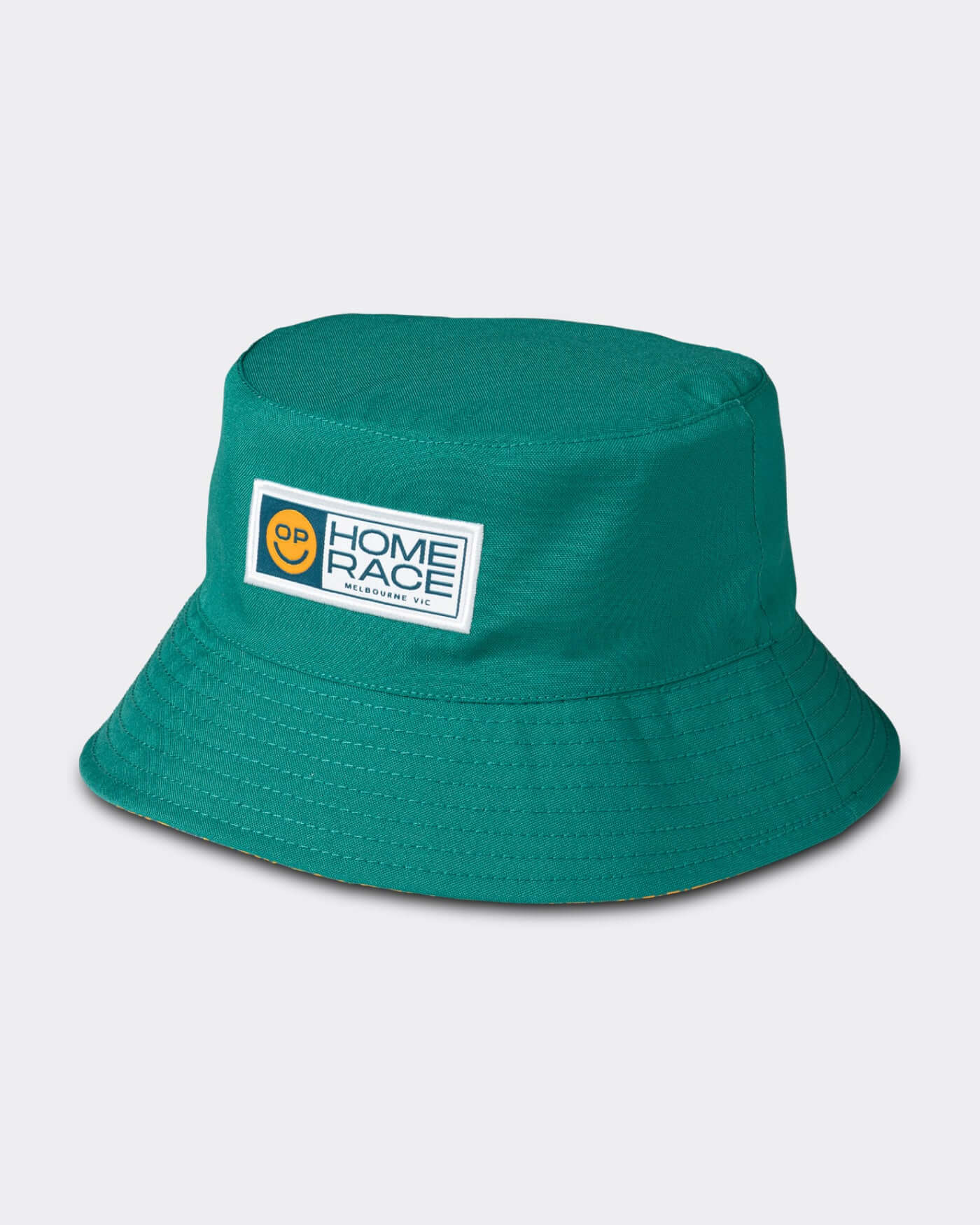 Home Race '26 Bucket Hat in Aussie green with OP smiley design, perfect for summer and outdoor events.