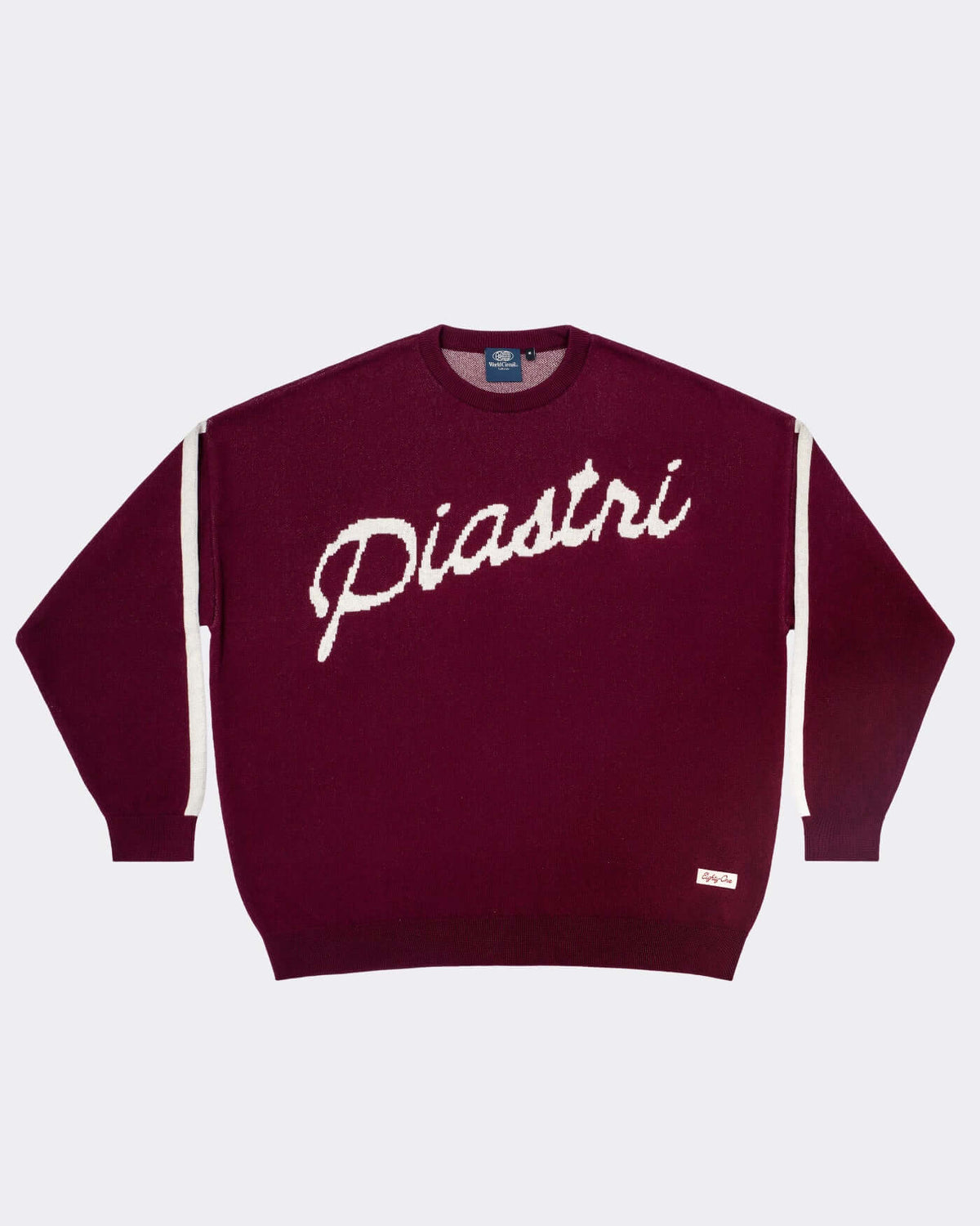 World Circuit Knitted Sweater - Burgundy featuring Piastri script in jacquard knit with off-white striped sleeves.