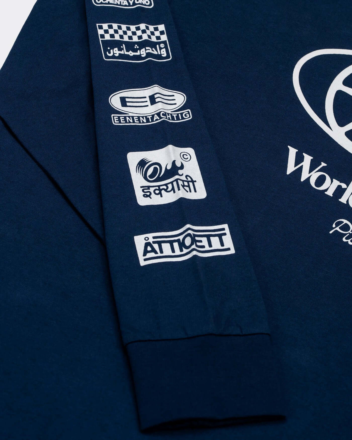 World Circuit Long Sleeve T-Shirt - Blue featuring sponsor graphics on the sleeve.
