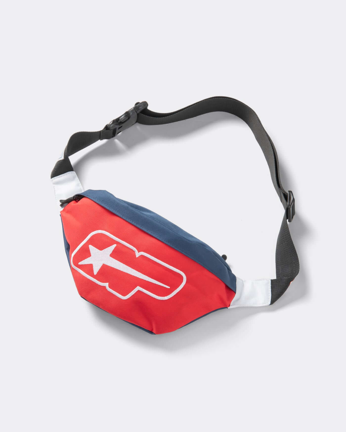 Origins Crossbody Bag in red and blue, a compact and bold accessory for hands-free style.
