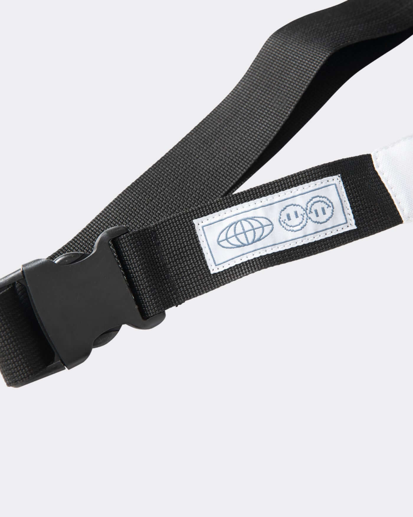 Origins Crossbody Bag adjustable strap showcasing bold design and functional buckle for a hands-free experience.