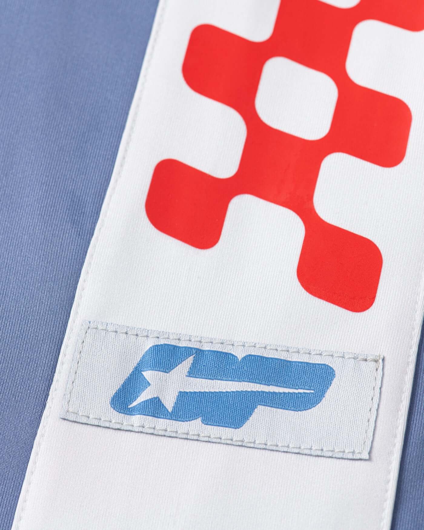 Close-up of the graphic details on the Origins Joggers, featuring bold trims and panels.