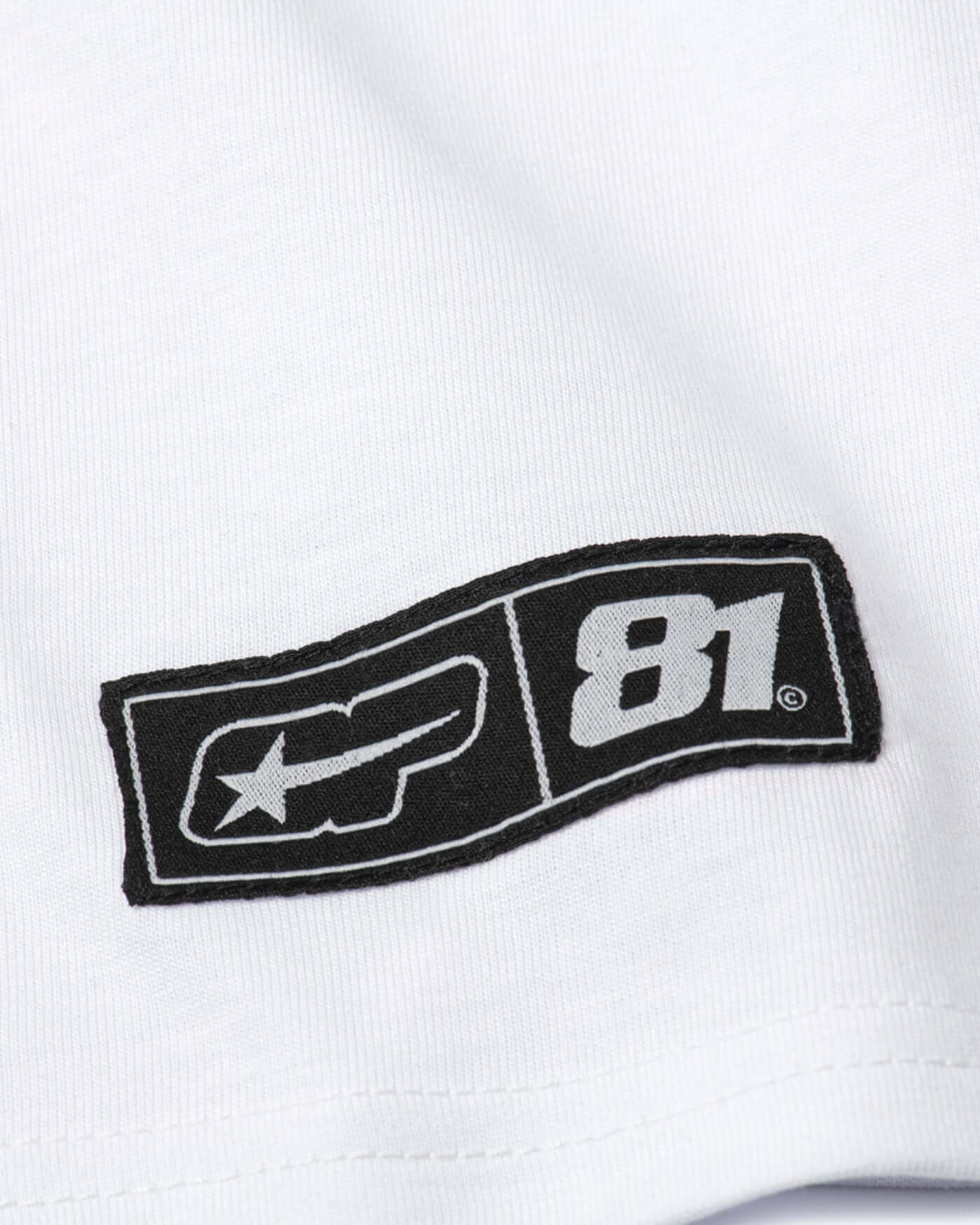 Origins T-Shirt - White logo detail featuring bold OP81 graphics on crisp white fabric.