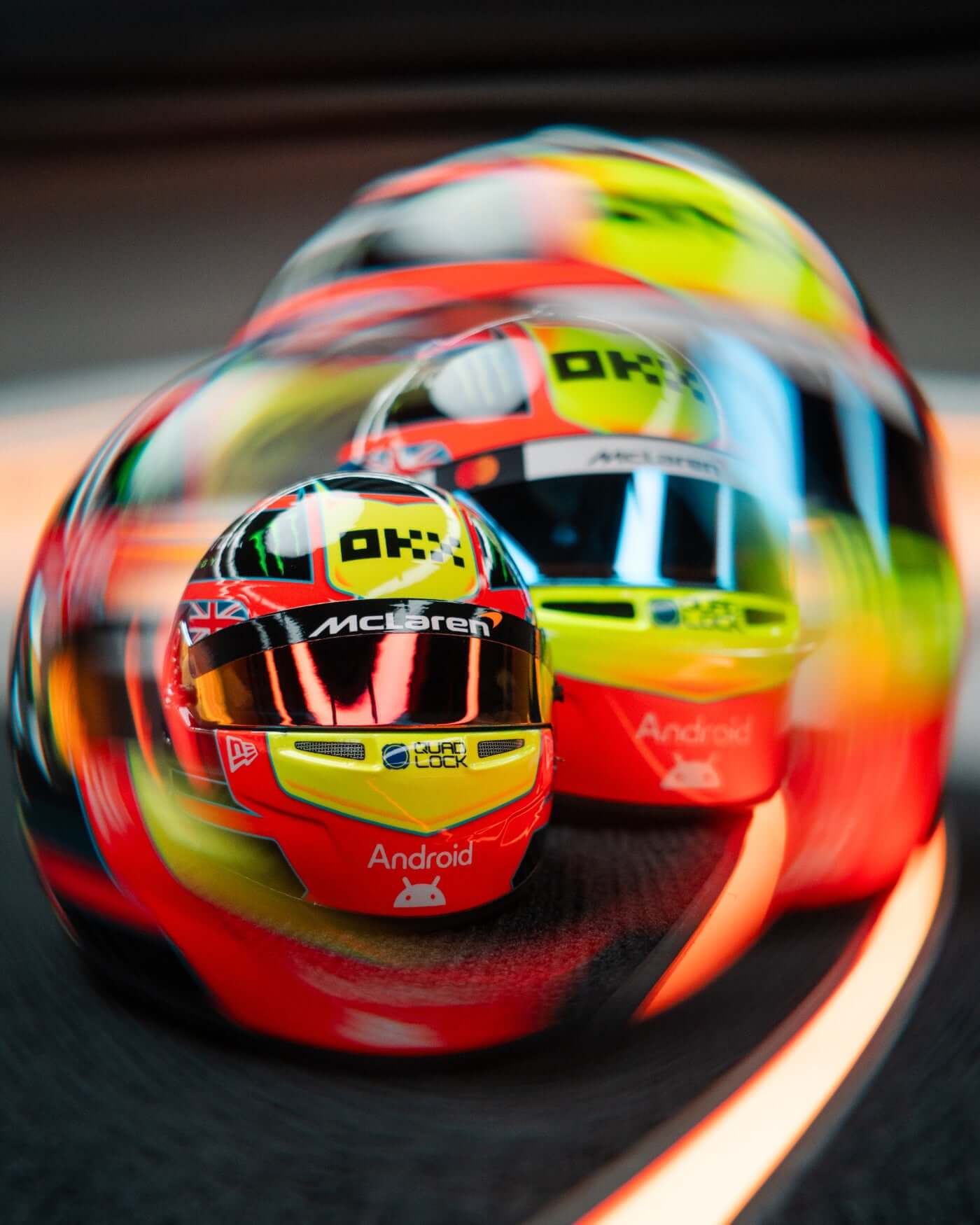 1:2 scale replica of Oscar Piastri's 2025 F1 season racing helmet in vibrant red, blue, and yellow design.