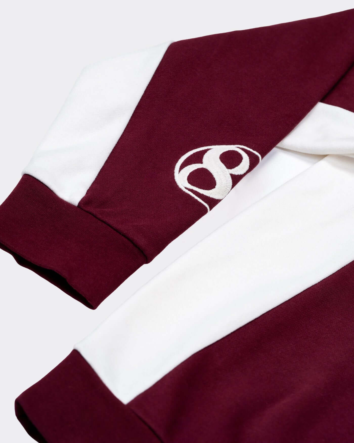 World Circuit Quarter Zip - Burgundy close-up view featuring burgundy and white color panels.