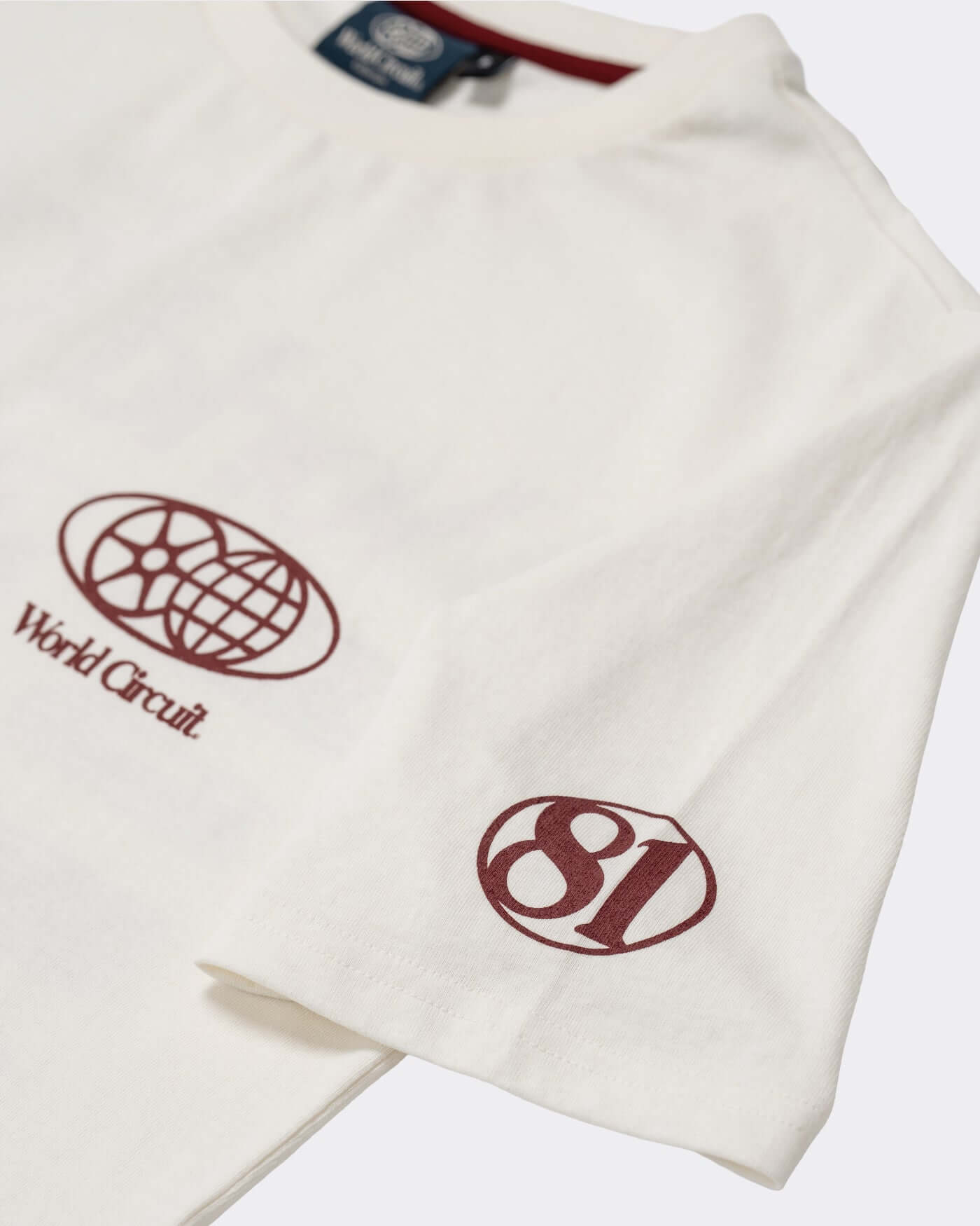 World Circuit T-Shirt - Off White featuring globe emblem on chest and 81 logo on sleeve.